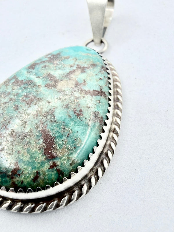 LONE MOUNTAIN TURQUOISE OVAL PENDANT BY LESLIE NEZ (PN 4)